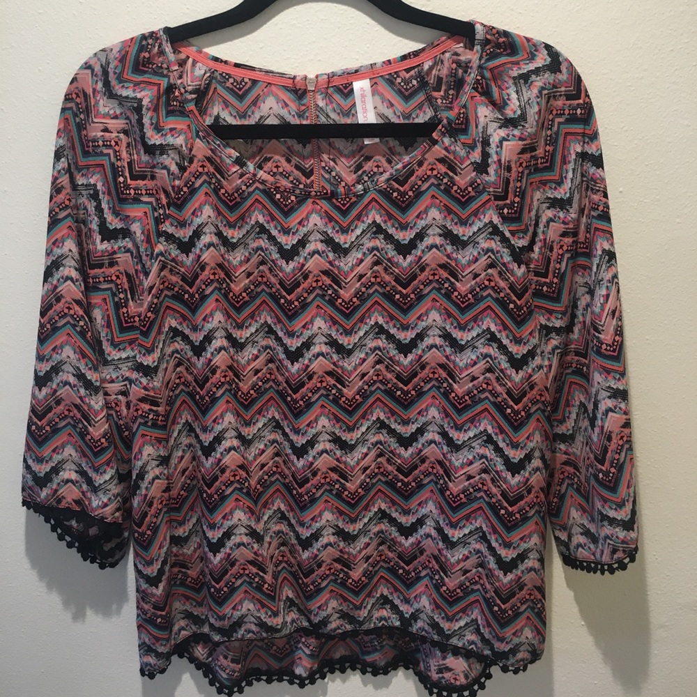Fun and flirty tunic with amazing detailing